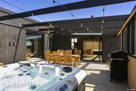 Genießen Sie den warmen Whirlpool im Luxusferienhaus Nr. 965 in Nordjütland
