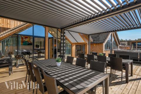 Genießen Sie einen Grillabend auf der Terrasse des Luxusferienhauses Nr. 332 in Westjütland