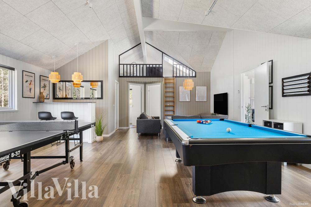Neben den vielen schönen Stunden, die man im Poolbereich des Hauses verbringen kann, bietet das Luxusferienhaus 351 auch Spielevergnügen bei Billard/Tischtennis und Darts
