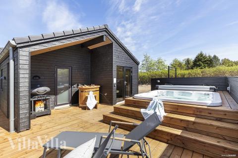 Genießen Sie den warmen Whirlpool im Luxusferienhaus Nr. 931 in Ostjütland