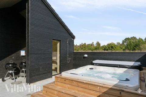 Genießen Sie den warmen Whirlpool im Luxusferienhaus Nr. 960 in Lolland/Falster/Mön
