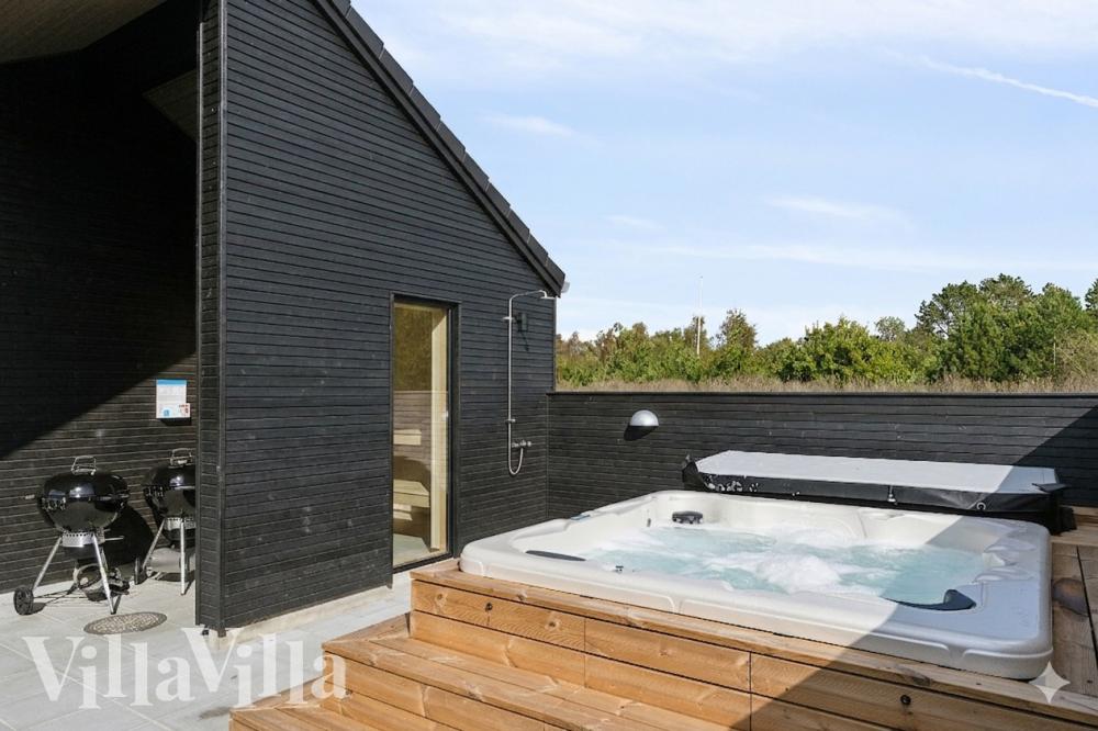 Genießen Sie den warmen Whirlpool im Luxusferienhaus Nr. 960 in Lolland/Falster/Mön