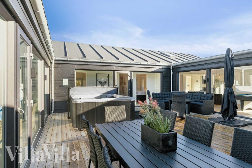 Genießen Sie einen Grillabend auf der Terrasse des Luxusferienhauses Nr. 967 in Ostjütland