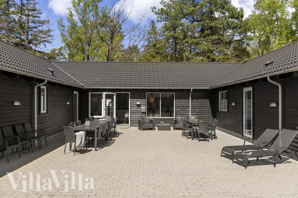 Genießen Sie einen Grillabend auf der Terrasse des Luxusferienhauses Nr. 351 in Nordseeland