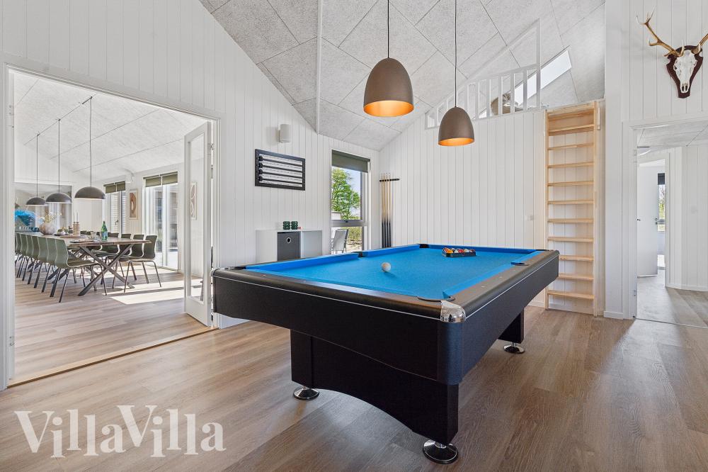 Neben den vielen schönen Stunden, die man im Poolbereich des Hauses verbringen kann, bietet das Luxusferienhaus 962 auch Spielevergnügen bei Billard/Tischtennis und Darts