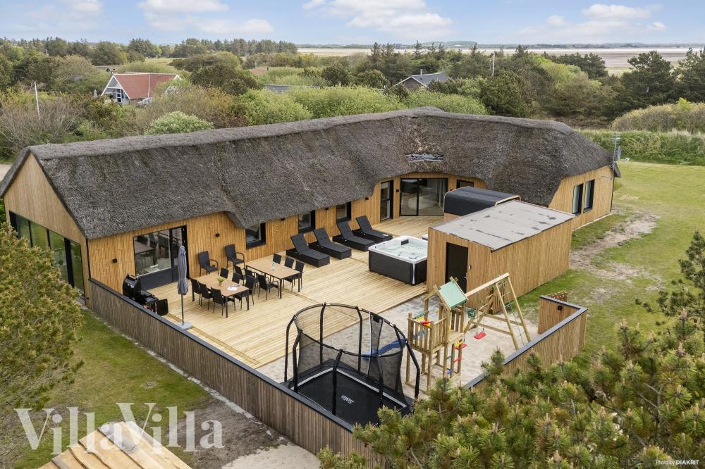 Dieses schöne Poolhaus Nr. 557 mit Platz für 14 Personen liegt in Westjütland