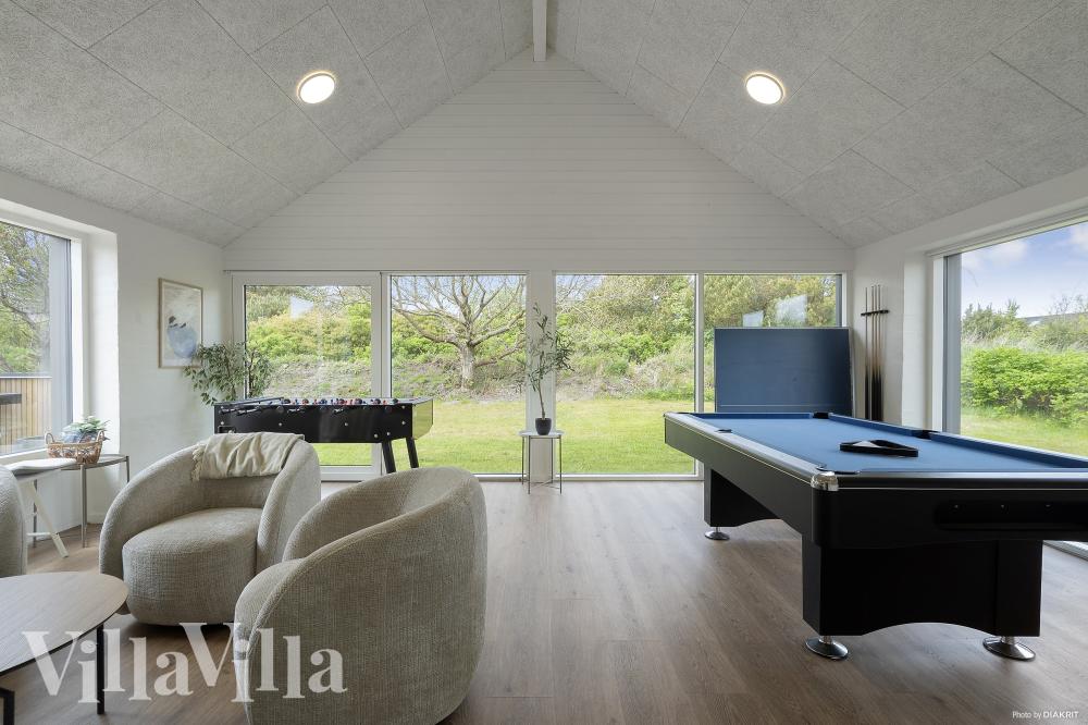 Neben den vielen schönen Stunden, die man im Poolbereich des Hauses verbringen kann, bietet das Luxusferienhaus 557 auch Spielevergnügen bei Billard/Tischtennis und Darts