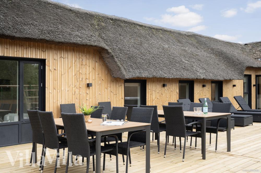 Genießen Sie einen Grillabend auf der Terrasse des Luxusferienhauses Nr. 557 in Westjütland