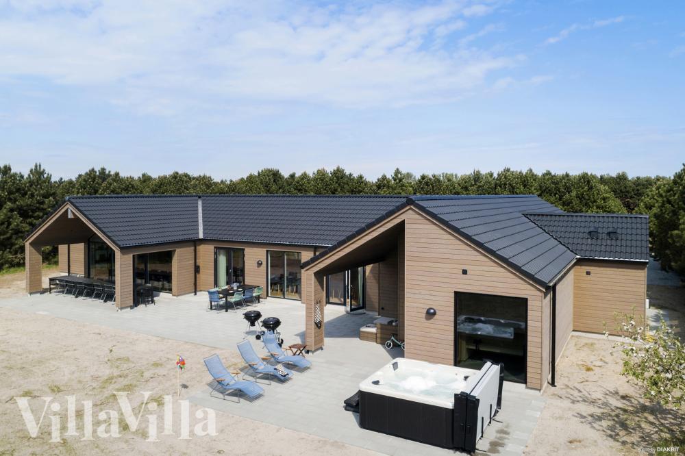 Genießen Sie einen Grillabend auf der Terrasse des Luxusferienhauses Nr. 934 in Lolland/Falster/Mön