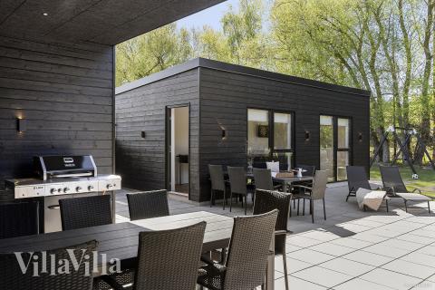 Genießen Sie einen Grillabend auf der Terrasse des Luxusferienhauses Nr. 979 in Ostjütland