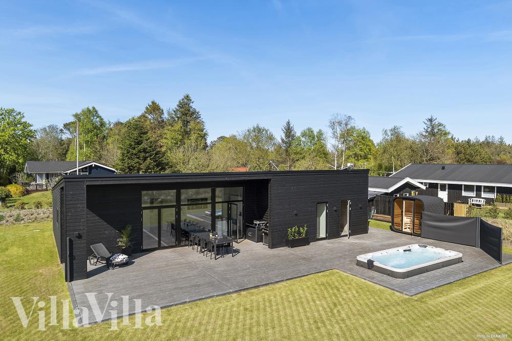 Diese schicke Haus mit Whirlpool Nr. 977 mit Platz für 10 Personen liegt in Nordjütland