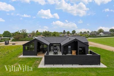 Diese schicke Haus mit Whirlpool Nr. 955 mit Platz für 12 Personen liegt in Fünen und seine Inseln