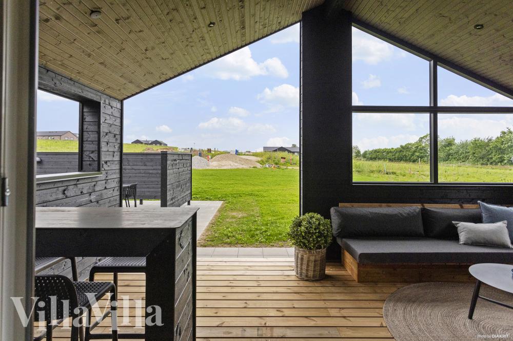 Genießen Sie einen Grillabend auf der Terrasse des Luxusferienhauses Nr. 955 in Fünen und seine Inseln