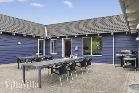 Genießen Sie einen Grillabend auf der Terrasse des Luxusferienhauses Nr. 314 in Lolland/Falster/Mön