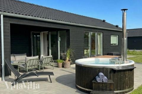 Genießen Sie den warmen Whirlpool im Luxusferienhaus Nr. 942 in Fünen und seine Inseln