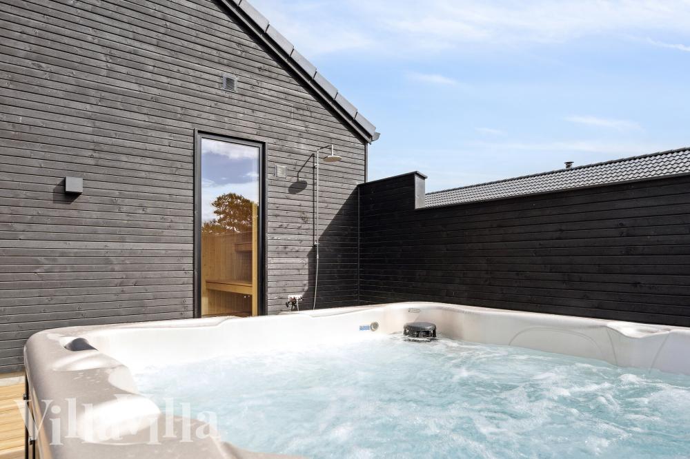 Genießen Sie den warmen Whirlpool im Luxusferienhaus Nr. 962 in Lolland/Falster/Mön