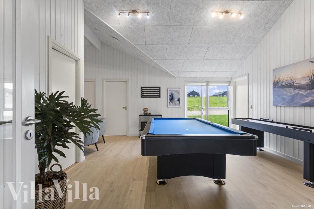 Neben den vielen schönen Stunden, die man im Poolbereich des Hauses verbringen kann, bietet das Luxusferienhaus 987 auch Spielevergnügen bei Billard/Tischtennis und Darts