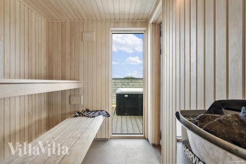 Genießen Sie die heiße Sauna im Luxusferienhaus Nr. 923 für 30 Personen