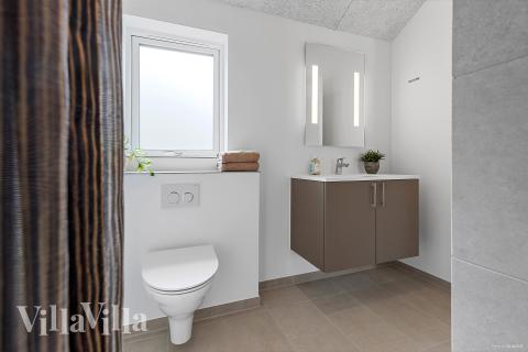 Eines der Badezimmer im Luxusferienhaus Nr. 828