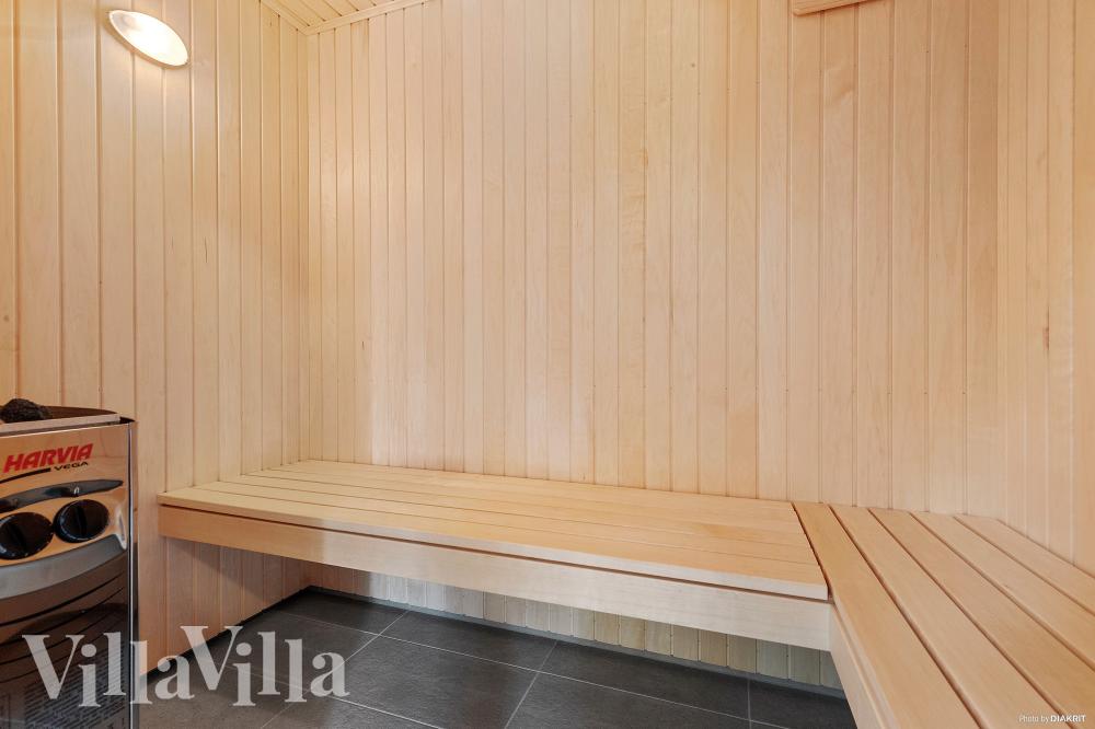 Genießen Sie die heiße Sauna im Luxusferienhaus Nr. 828 für 26 Personen