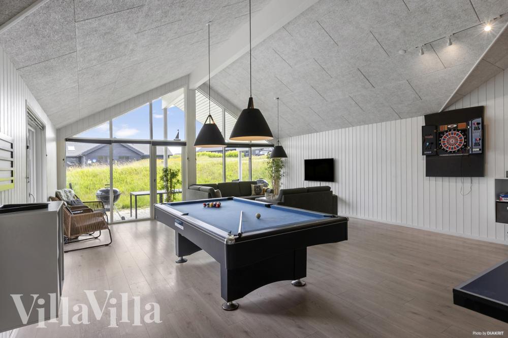 Neben den vielen schönen Stunden, die man im Poolbereich des Hauses verbringen kann, bietet das Luxusferienhaus 491 auch Spielevergnügen bei Billard/Tischtennis und Darts