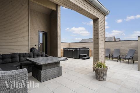 Genießen Sie einen Grillabend auf der Terrasse des Luxusferienhauses Nr. 929 in Westjütland