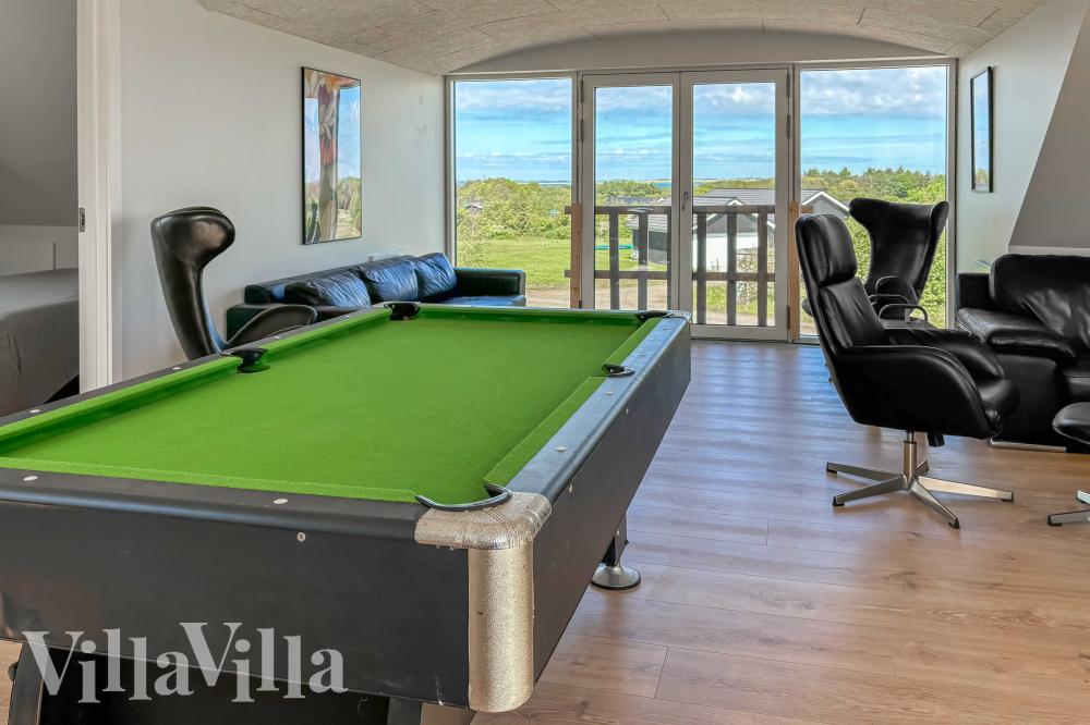 Neben den vielen schönen Stunden, die man im Poolbereich des Hauses verbringen kann, bietet das Luxusferienhaus 981 auch Spielevergnügen bei Billard/Tischtennis und Darts