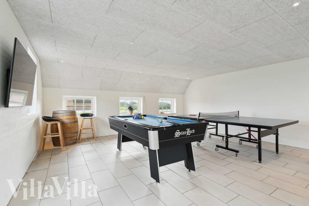 Neben den vielen schönen Stunden, die man im Poolbereich des Hauses verbringen kann, bietet das Luxusferienhaus 982 auch Spielevergnügen bei Billard/Tischtennis und Darts