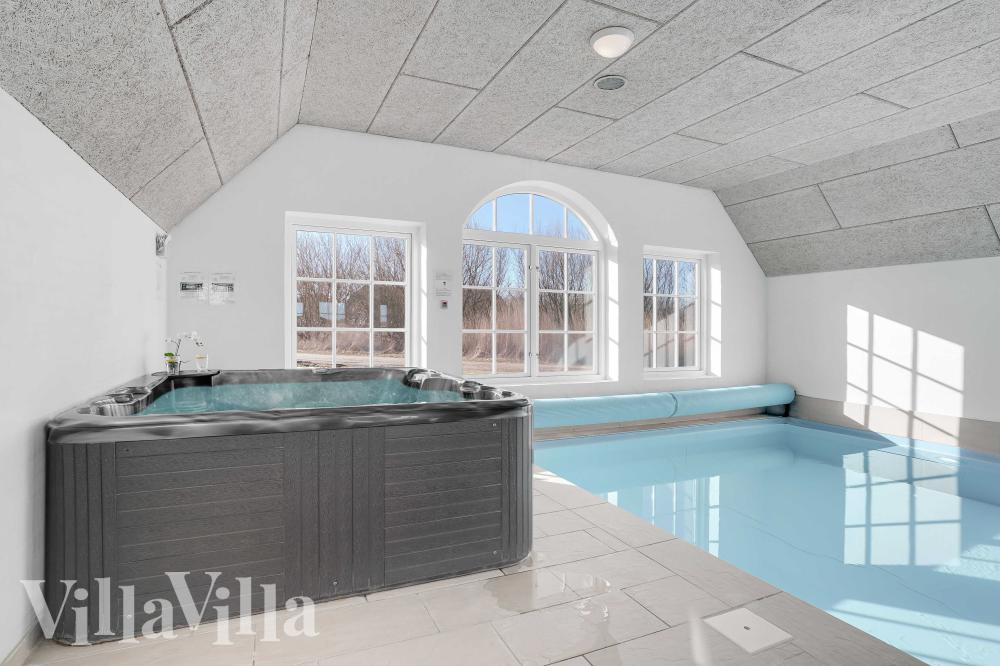 Genießen Sie den warmen Whirlpool im Luxusferienhaus Nr. 982 in Westjütland