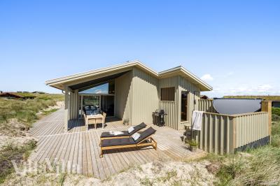 Diese schicke Haus mit Whirlpool Nr. 986 mit Platz für 12 Personen liegt in Nordjütland