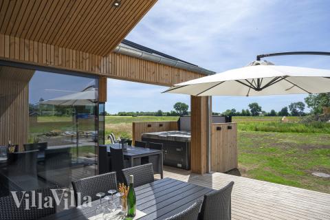 Genießen Sie den warmen Whirlpool im Luxusferienhaus Nr. 975 in Fünen und seine Inseln