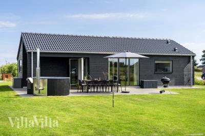 Diese schicke Haus mit Whirlpool Nr. 942 mit Platz für 8 Personen liegt in Fünen und seine Inseln