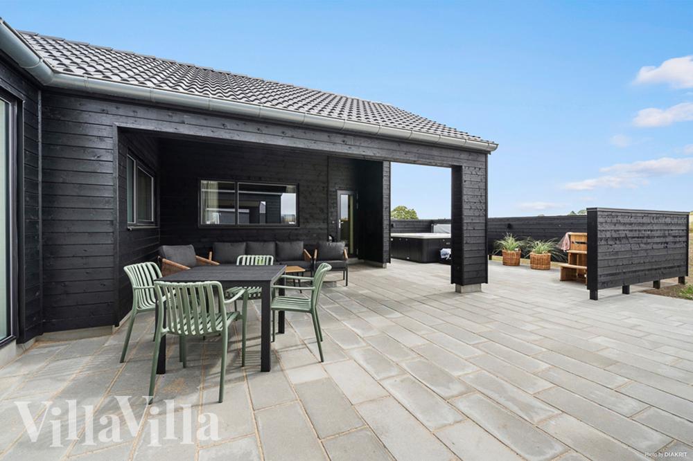 Genießen Sie einen Grillabend auf der Terrasse des Luxusferienhauses Nr. 957 in Fünen und seine Inseln
