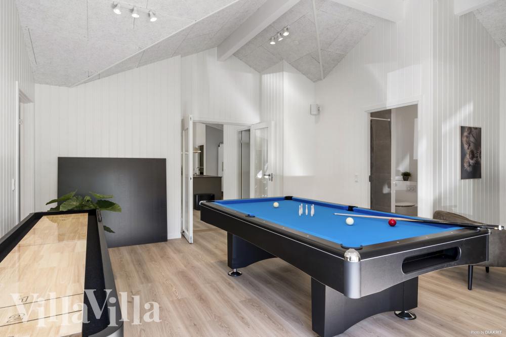 Neben den vielen schönen Stunden, die man im Poolbereich des Hauses verbringen kann, bietet das Luxusferienhaus 987 auch Spielevergnügen bei Billard/Tischtennis und Darts