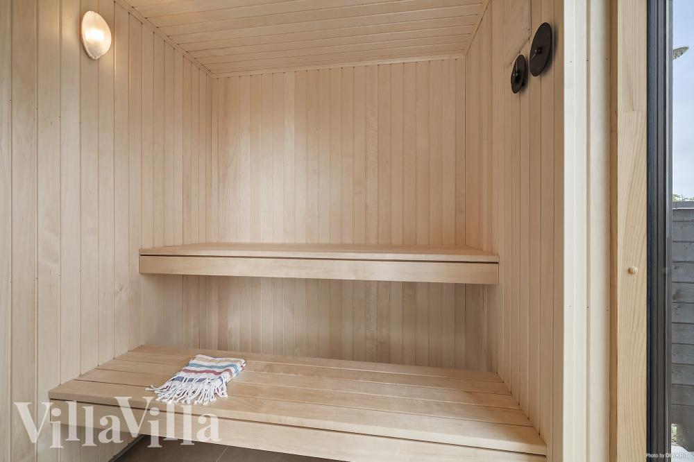 Genießen Sie die heiße Sauna im Luxusferienhaus Nr. 957 für 16 Personen