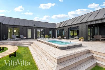 Diese schicke Haus mit Whirlpool Nr. 992 mit Platz für 8 Personen liegt in Südjütland
