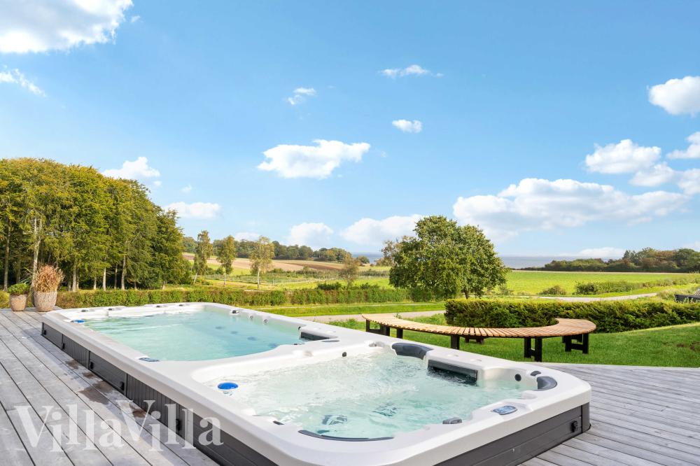 Genießen Sie den warmen Whirlpool im Luxusferienhaus Nr. 992 in Südjütland