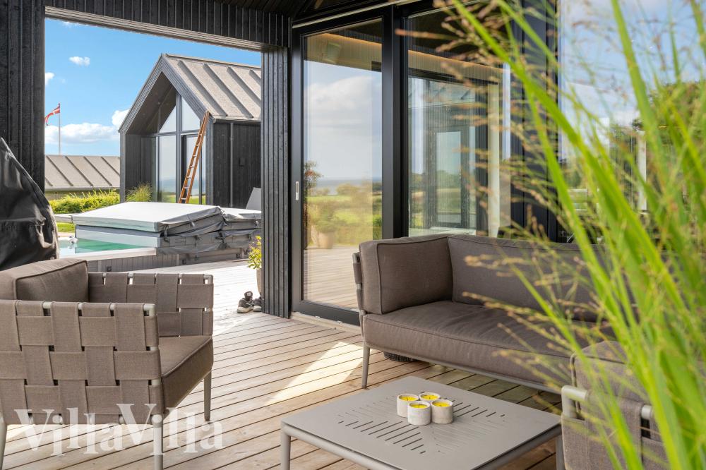 Genießen Sie einen Grillabend auf der Terrasse des Luxusferienhauses Nr. 992 in Südjütland