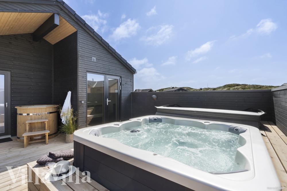 Genießen Sie den warmen Whirlpool im Luxusferienhaus Nr. 947 in Westjütland