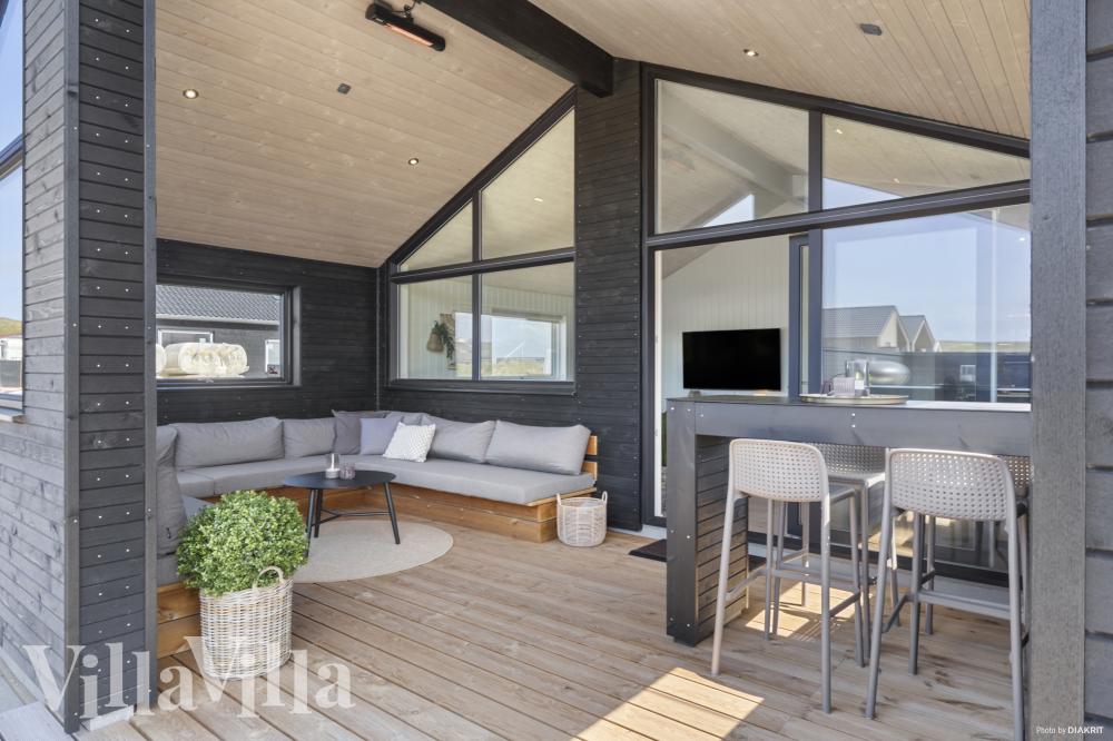Genießen Sie einen Grillabend auf der Terrasse des Luxusferienhauses Nr. 947 in Westjütland