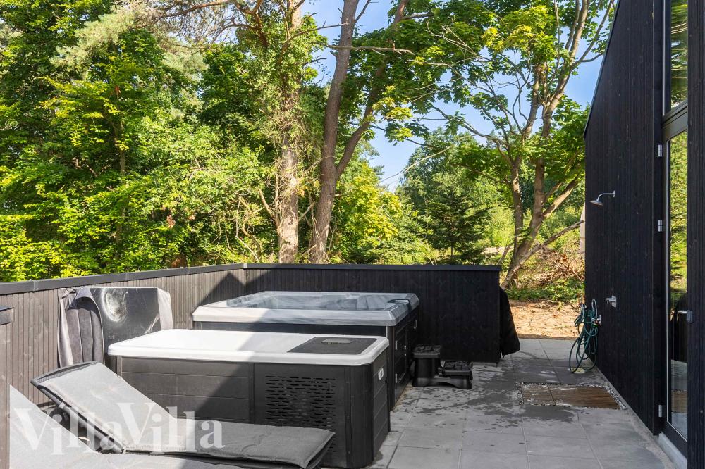 Genießen Sie den warmen Whirlpool im Luxusferienhaus Nr. 994 in Ostjütland