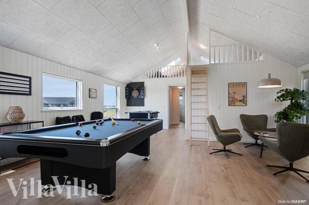 Neben den vielen schönen Stunden, die man im Poolbereich des Hauses verbringen kann, bietet das Luxusferienhaus 921 auch Spielevergnügen bei Billard/Tischtennis und Darts