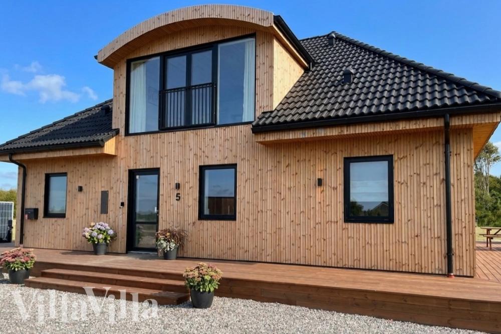 Diese schicke Haus mit Whirlpool Nr. 981 mit Platz für 14 Personen liegt in Limfjord