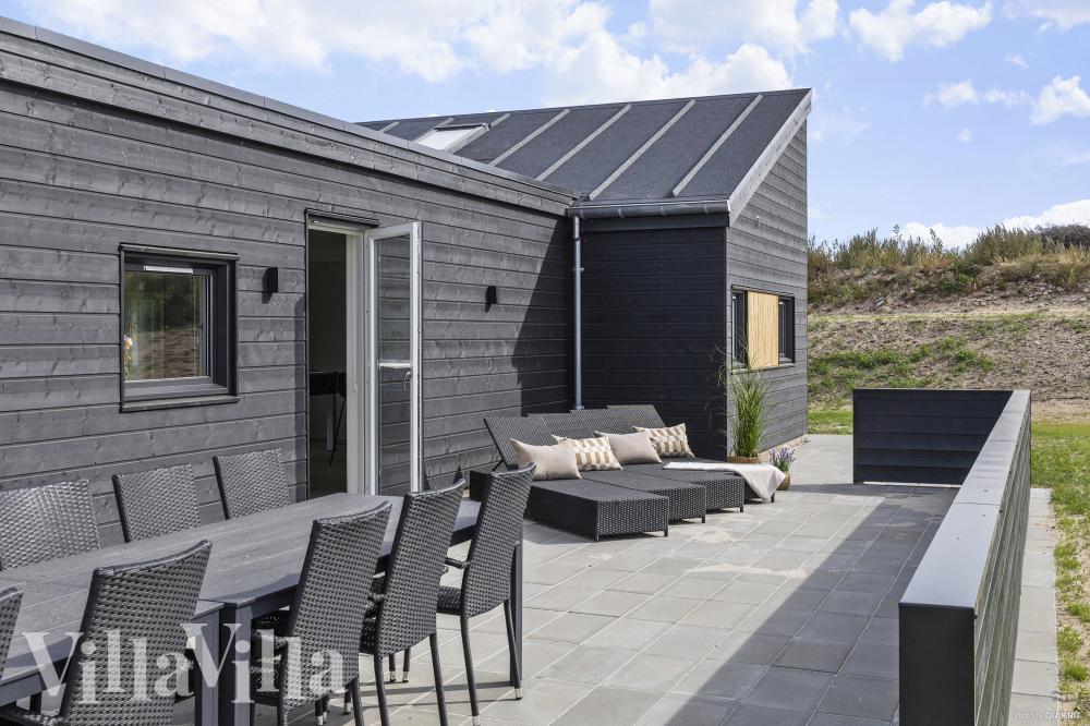 Genießen Sie einen Grillabend auf der Terrasse des Luxusferienhauses Nr. 967 in Ostjütland