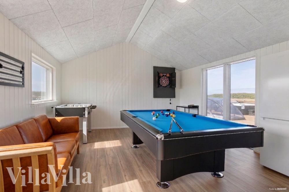Neben den vielen schönen Stunden, die man im Poolbereich des Hauses verbringen kann, bietet das Luxusferienhaus 669 auch Spielevergnügen bei Billard/Tischtennis und Darts
