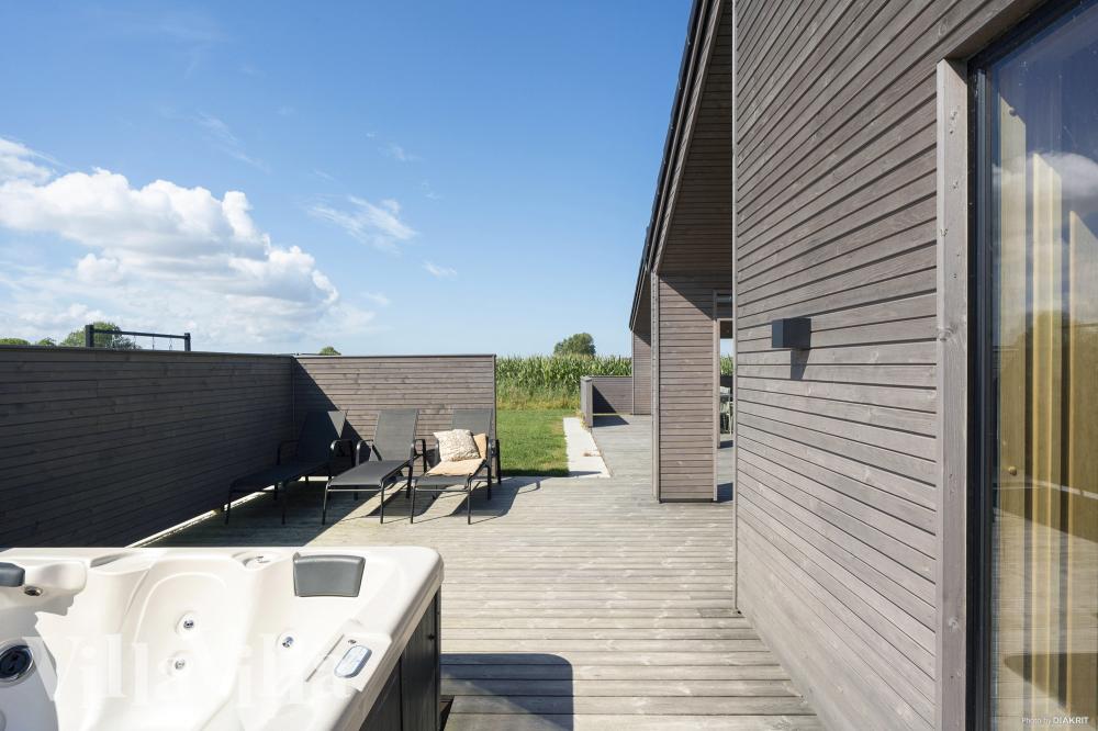 Genießen Sie den warmen Whirlpool im Luxusferienhaus Nr. 648 in Fünen und seine Inseln