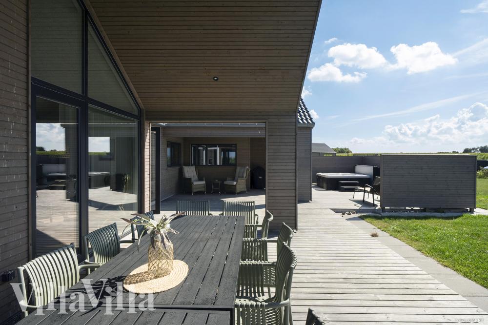 Genießen Sie einen Grillabend auf der Terrasse des Luxusferienhauses Nr. 648 in Fünen und seine Inseln
