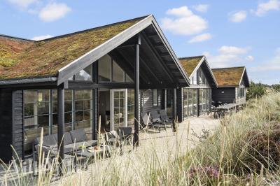 Dieses schöne Poolhaus Nr. 383 mit Platz für 18 Personen liegt in Westjütland