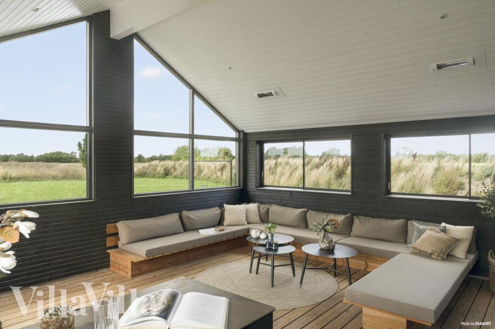 Genießen Sie einen Grillabend auf der Terrasse des Luxusferienhauses Nr. 910 in Lolland/Falster/Mön