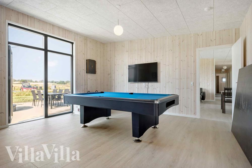 Neben den vielen schönen Stunden, die man im Poolbereich des Hauses verbringen kann, bietet das Luxusferienhaus 1014 auch Spielevergnügen bei Billard/Tischtennis und Darts